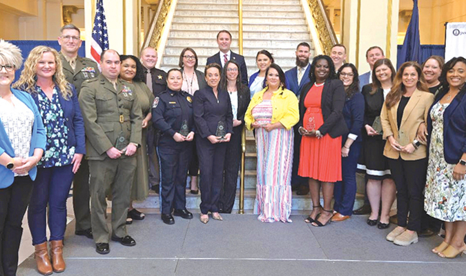 The Unsung Hero Award winners pose with Attorney General Jason Miyares.  ATTORNEY GENERAL’S OFFICE PHOTO