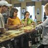 <p>Suzanne Lawson shares information about MountainRose wines during a tasting Saturday with Norton residents Greg Bolling and wife Lisa as their daughter Kristina listens. JENAY TATE PHOTO.</p><a href="/pages/submit_photo_reprint">Click Here</a><p>to order photo reprints</p>