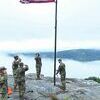 Virginia Army National Guard soldiers and ROTC cadets salute a new flag they placed on Norton’s Flag Rock Friday as part of events commemorating the 9/11 attacks. ARMY NATIONAL GUARD PHOTO