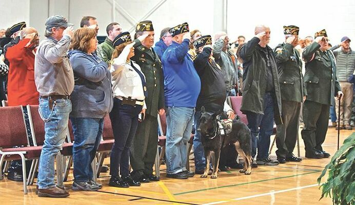 Veterans salute the flag.

MICHELLE MULLINS PHOTO