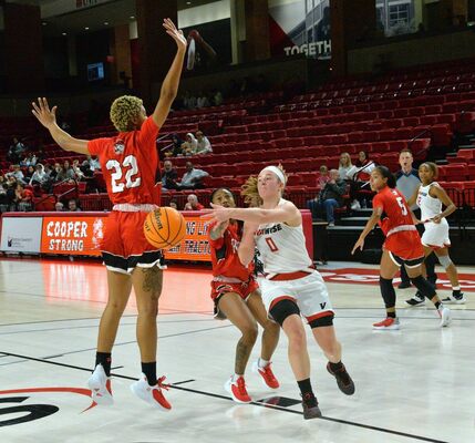 UVA Wise senior Caitlyn Ross doing what she does best and finding the open teammate. PHOTO BY KELLEY PEARSON