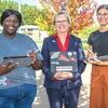 UVA Wise senior Naya Davis, Chancellor Donna P. Henry and senior McKenzie Dkystra pose with their iPads.  UVA WISE PHOTO