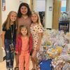 <p>Looking all grown up now at almost 13, Sophie Fleming, in rear, stands amid the Easter basket gifts for St. Jude with, from left, cousin Emily Anderson and sisters Josie Fleming and Lylah Fleming. Myranda Fleming PHOTO</p>