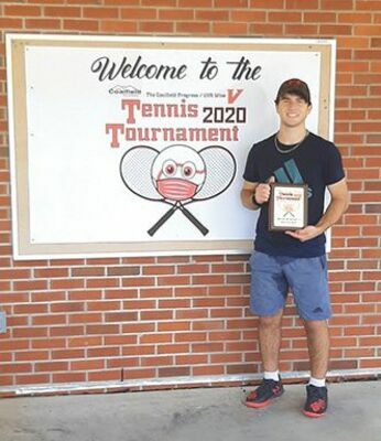 Sean Given wins the men’s B singles division.