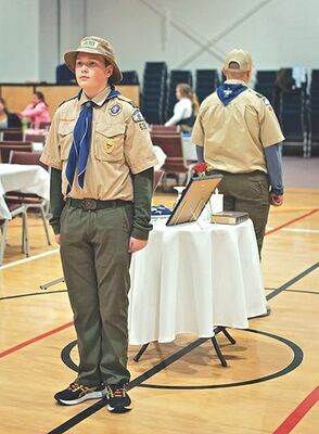 Scouts from Troop 630 stand vigil over the Missing Man Table.

MICHELLE MULLINS PHOTO
