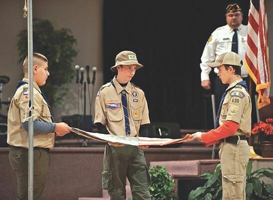 Boy Scouts Gabe Ringley, Ethan Sturgill and Tavish Stratton fold a flag prior to its retirement during last weekend’s third annual Celebration of Heroes event celebrating Veterans Day.

MICHELLE MULLINS PHOTO