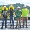 Zack Phipps, Isaiah Meeks, Noah Mullins and Anthony Hamilton are installing solar power at St. Paul Elementary School.  KENNETH CROWSON PHOTO