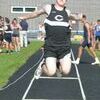 Central’s Ethan Mullins gets some height in the long jump at the last chance meet at Ridgeview.