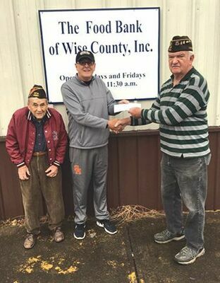 Thank you to VFW Post 4301 of Norton for their recent donation to the Food Bank of Wise County.  Pictured are VFW members Burns Gilliam and Phillip Adams 
presenting a 
check to Bill Gilliam, chairman 
of the food bank board.