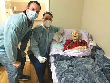 Dr. Mark Raymond and Devin Cradic with 102-year-old Mildred Adams.