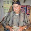u Bob Salyers displays his Army canteen cup, lost for 66 years but returned to him recently.