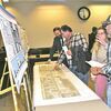 During a Wednesday event at city hall, Norton residents Gordon and Jane Sandt, right, examine Virginia Department of Transportation maps showing traffic management options for the downtown corridor. Public comments on downtown traffic are being accepted through Jan. 25.  JEFF LESTER PHOTO