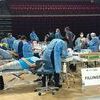 Student volunteers perform dental fillings Saturday during the Missions of Mercy free dental clinic at UVA Wise.  LISA MAINE PHOTO