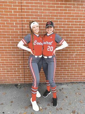 Fellow teammate Maggie Shell captures the Lady Warrior softball seniors, Olivia Basham and Hannah Carter, before their first and only game so far this season.