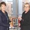 College official Shannon Blevins and Chancellor Donna P. Henry display the designation award.  UVA WISE PHOTO